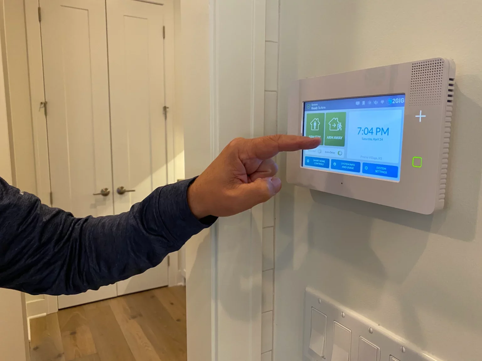 a-man-sets-his-alarm-on-his-home-security-panel-at-2024-09-23-00-51-39-utc